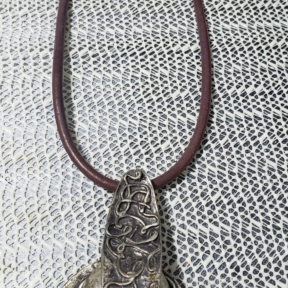 Statement necklace with brown leather choker.
